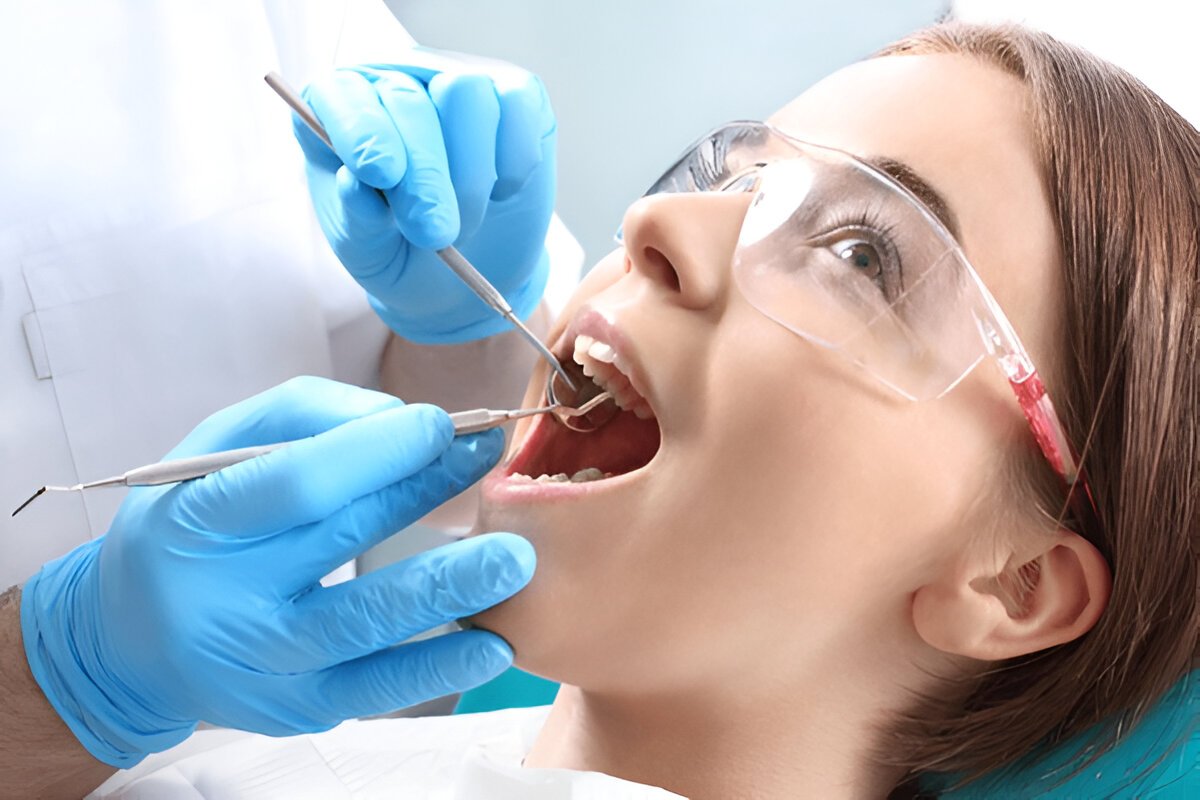 Patient receiving tooth filling treatment at Granada Dental in Sherwood Park